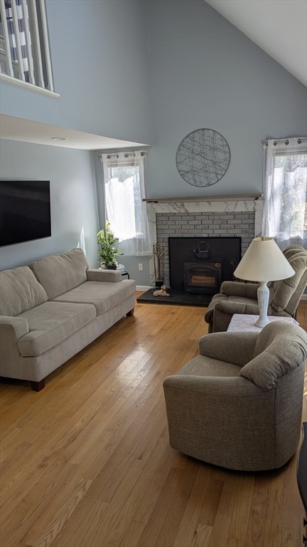 92 Santuit Pond Road Mashpee, MA 02649 - Photo 15 of 23 a living room with furniture and a fireplace