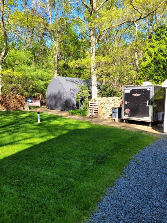 92 Santuit Pond Road Mashpee, MA 02649 - Photo 19 of 23 a view of an outdoor space and yard