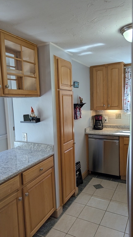 92 Santuit Pond Road Mashpee, MA 02649 - Photo 7 of 23 a kitchen with stainless steel appliances granite countertop a refrigerator sink and cabinets