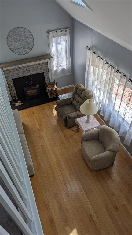 92 Santuit Pond Road Mashpee, MA 02649 - Photo 10 of 23 a living room with furniture and a fireplace