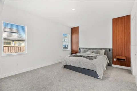 a bedroom with a bed and window