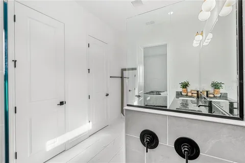 a view of a backyard with a garden and deck