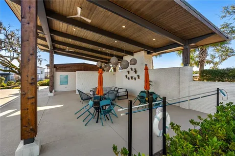 a street sign on a sidewalk next to a road