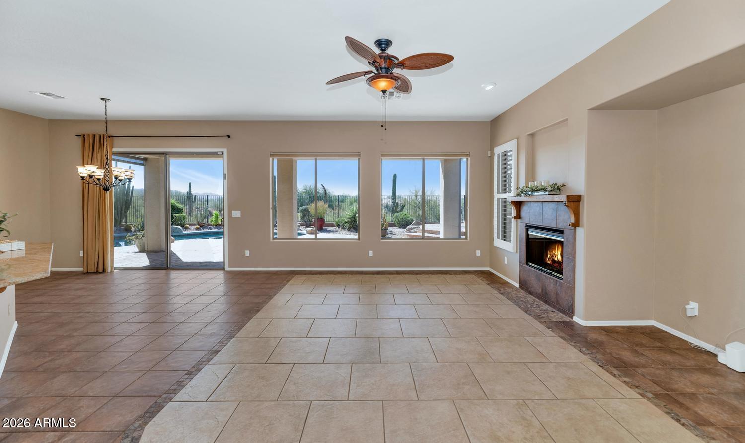 41123 North River Bend Road Phoenix, AZ 85086 - Photo 16 of 45 a view of an empty room with a window and kitchen view