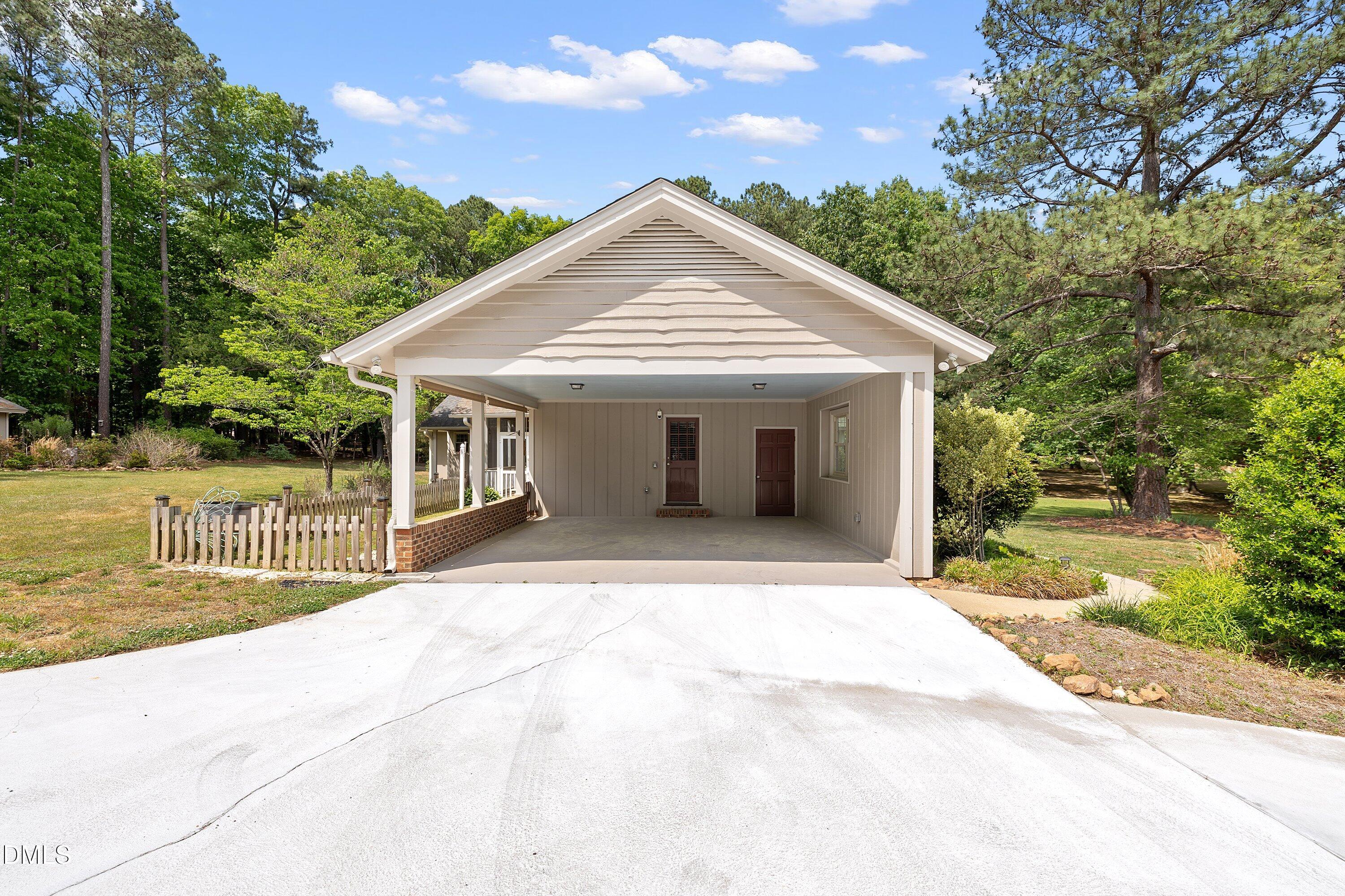 8133 Holly Forest Road Wake Forest, NC 27587 - Photo 50 of 50 a view of a house with a yard and potted plants