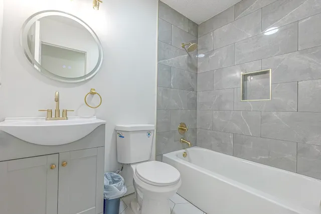 a bathroom with a sink toilet and a bathtub