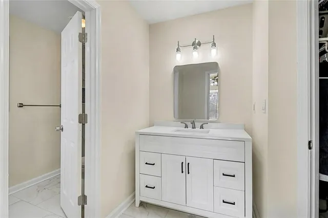 a bathroom with a double vanity sink and mirror