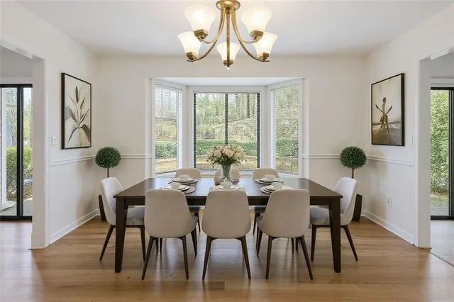 a view of a dining room with furniture window and wooden floor