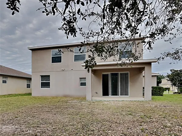 a house with trees in front of it