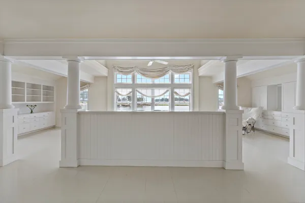 a view of an empty room and a balcony