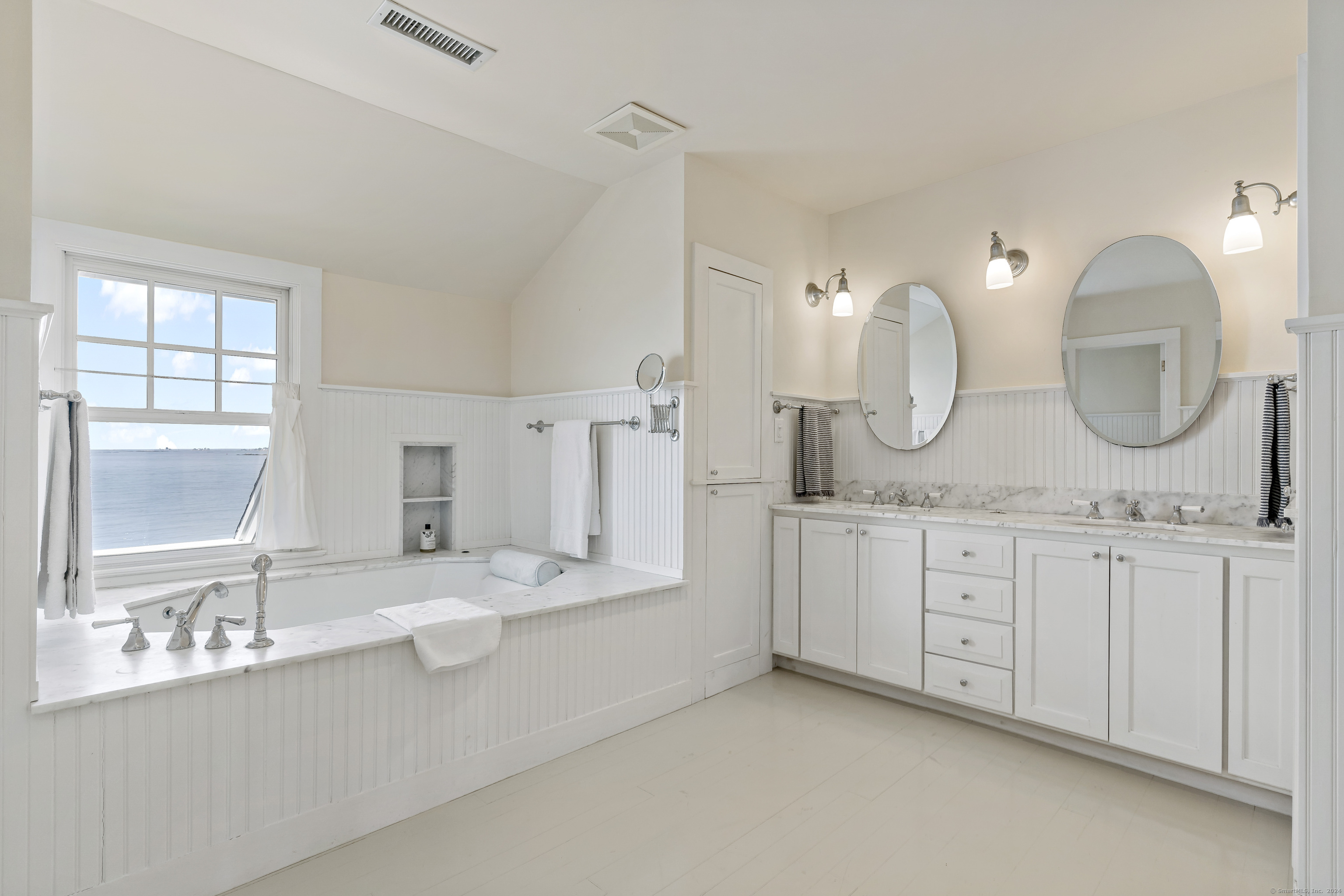 Potato Island Branford, CT 06405 - Photo 19 of 31 a spacious bathroom with a double vanity sink mirror and bathtub