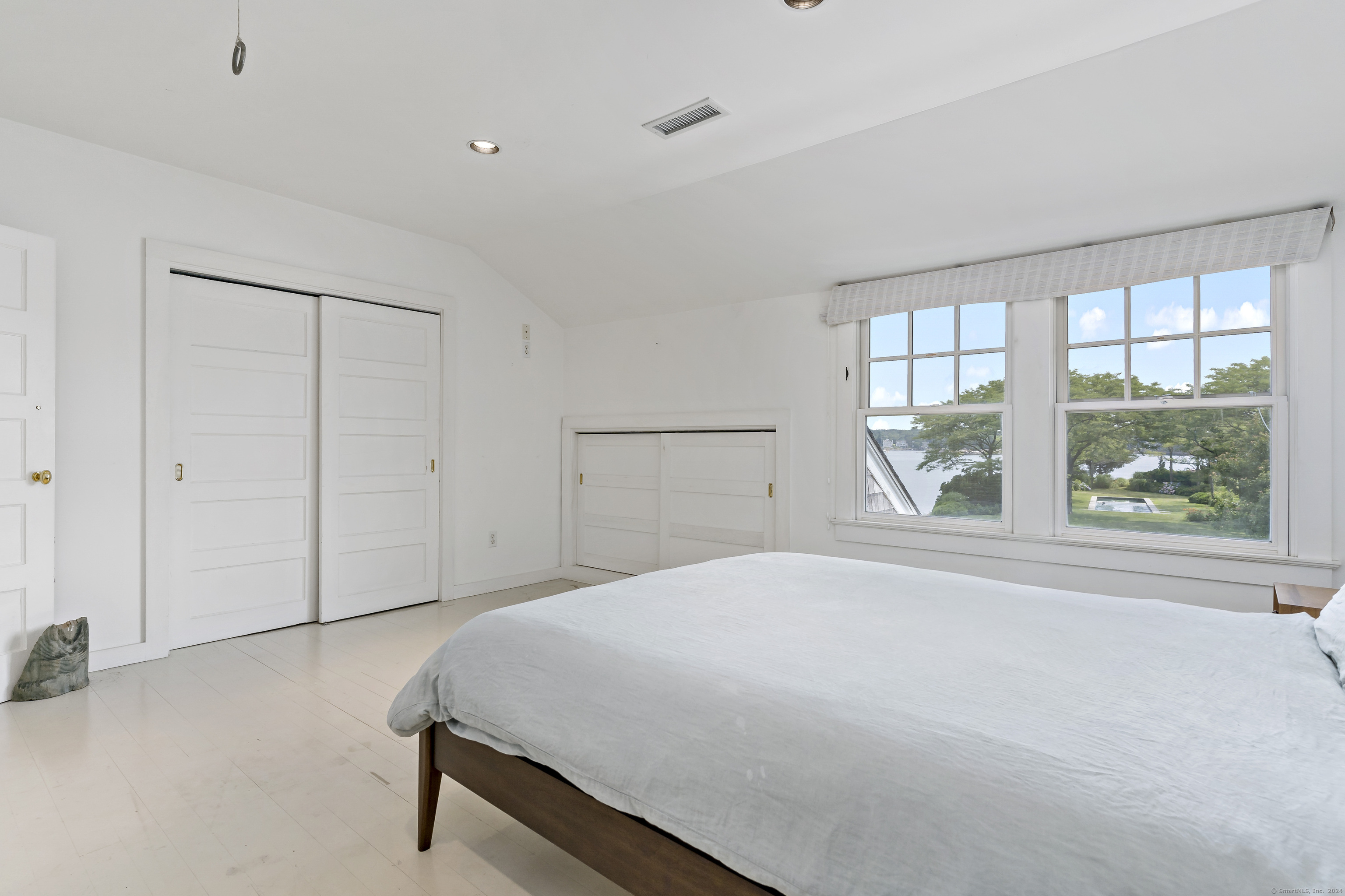 Potato Island Branford, CT 06405 - Photo 25 of 31 a spacious bedroom with a bed and a window