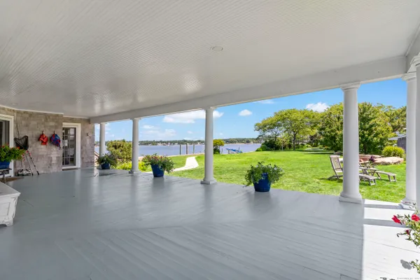a view of a room with wooden floor and outdoor space