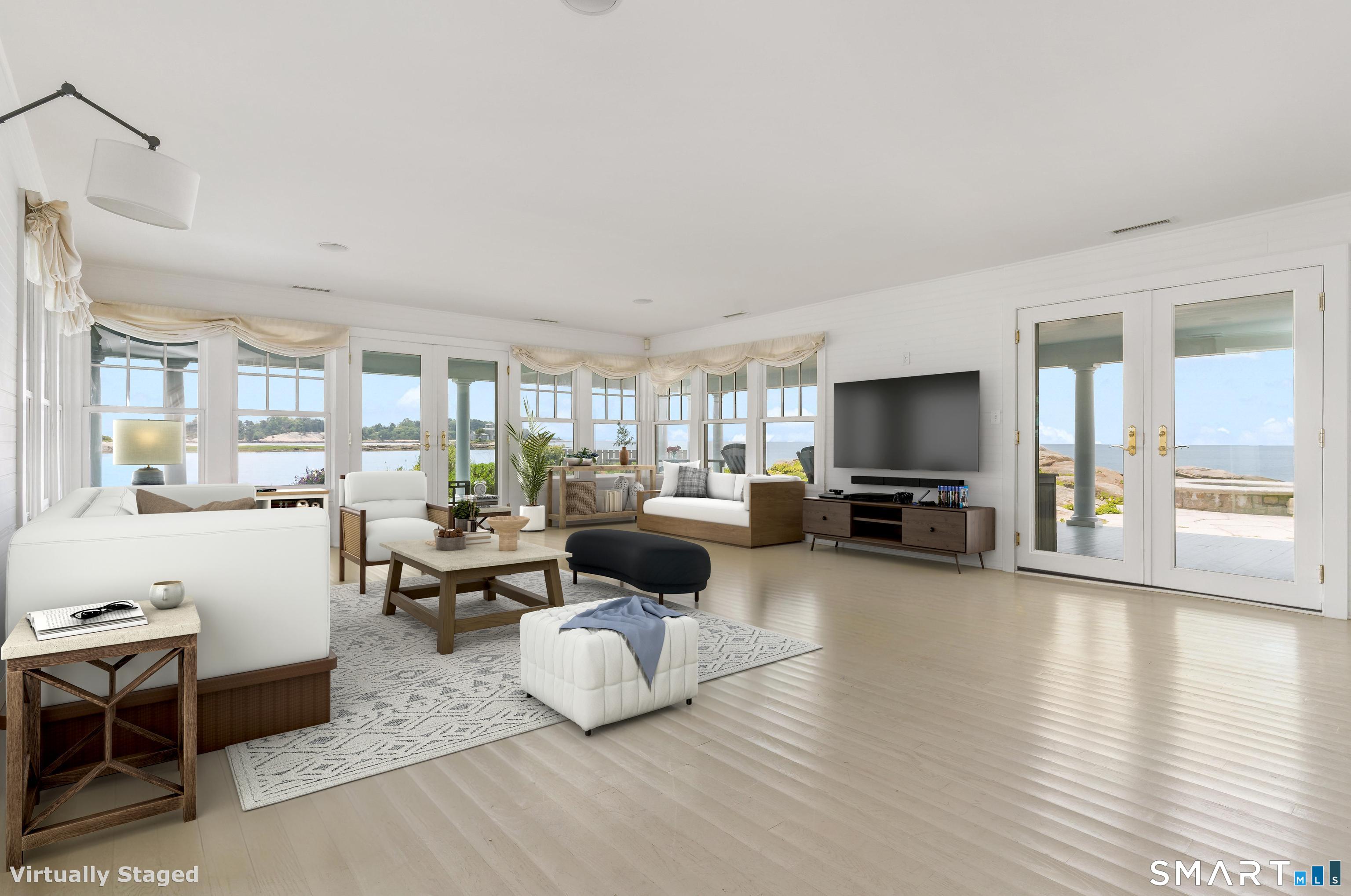 Potato Island Branford, CT 06405 - Photo 10 of 31 a living room with furniture and a flat screen tv