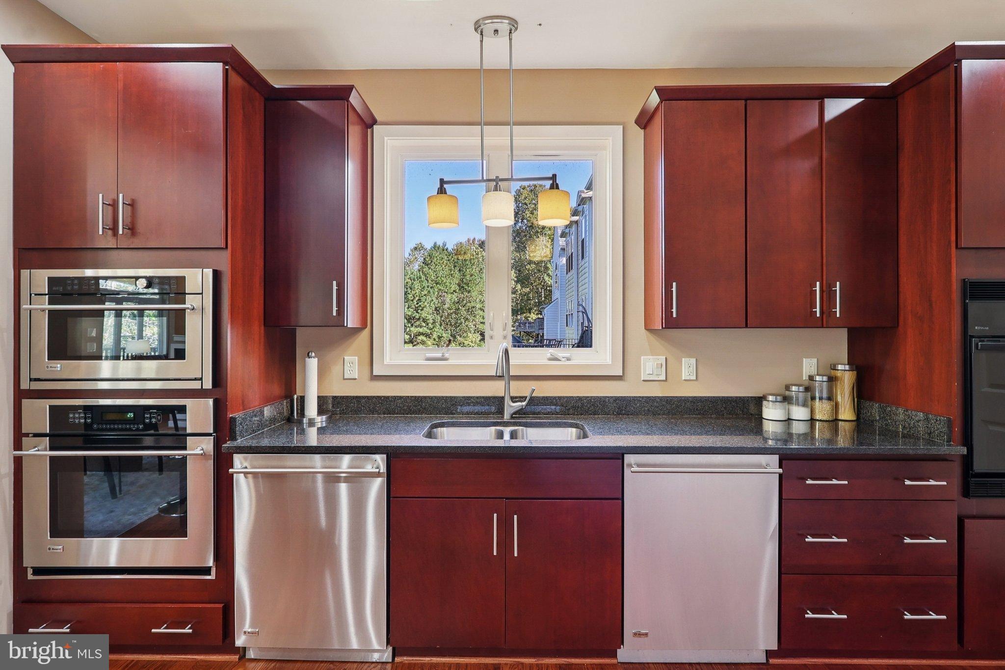 3211 Courtside Road Bowie, MD 20721 - Photo 14 of 108 Modern kitchen with rich wood cabinetry.