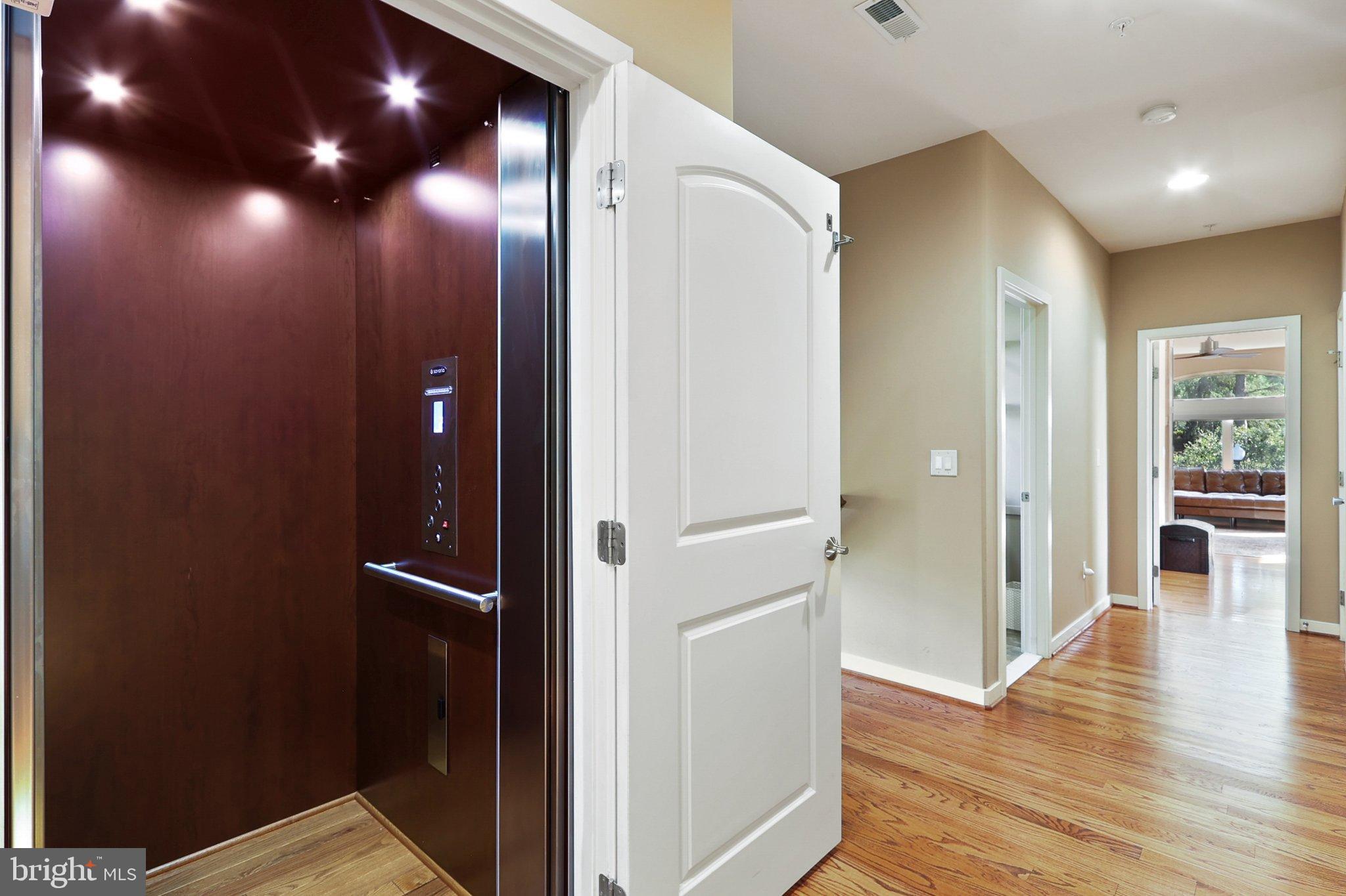 3211 Courtside Road Bowie, MD 20721 - Photo 34 of 108 Sleek elevator entrance in modern home.