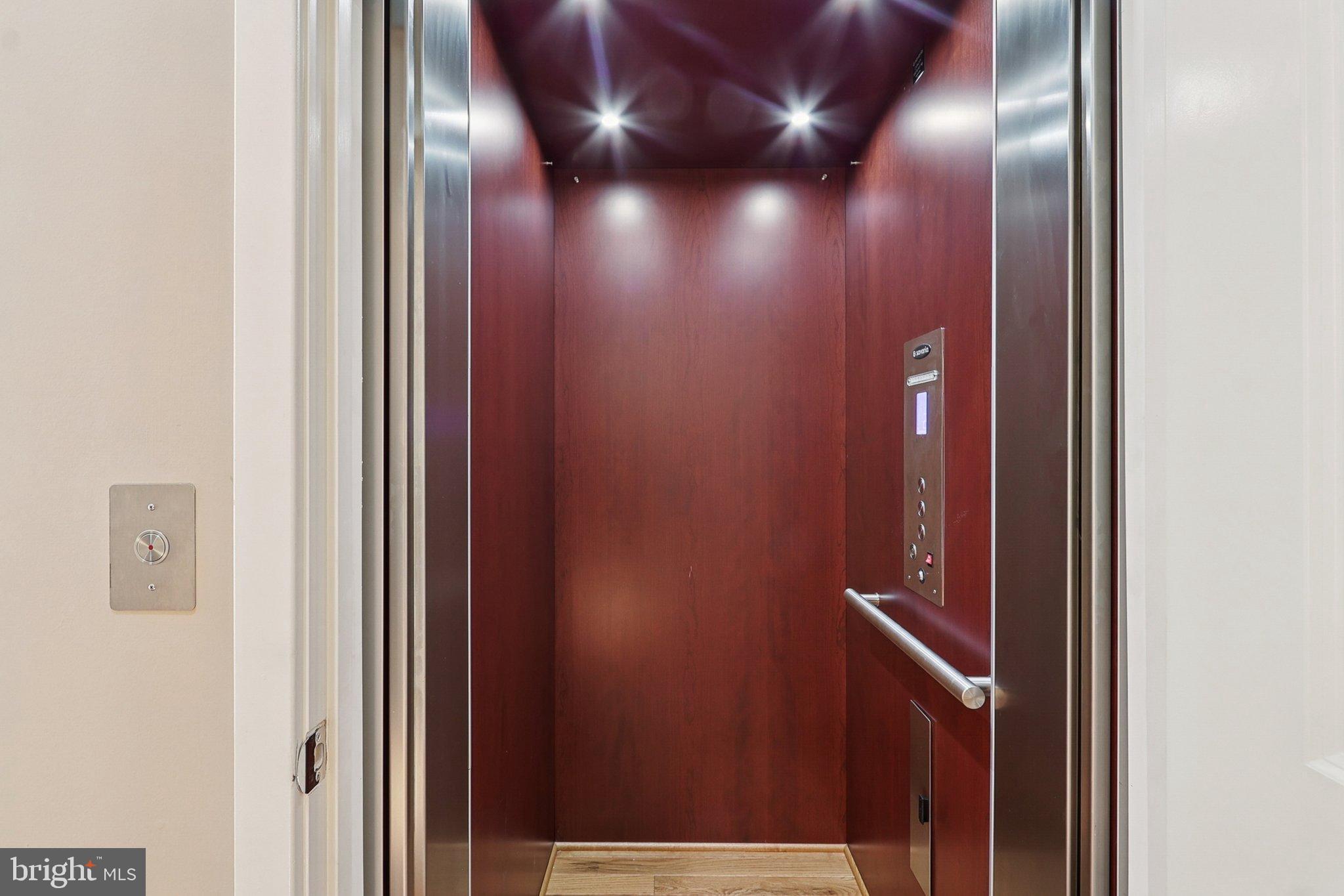 3211 Courtside Road Bowie, MD 20721 - Photo 35 of 108 Sleek elevator with rich wood accents.