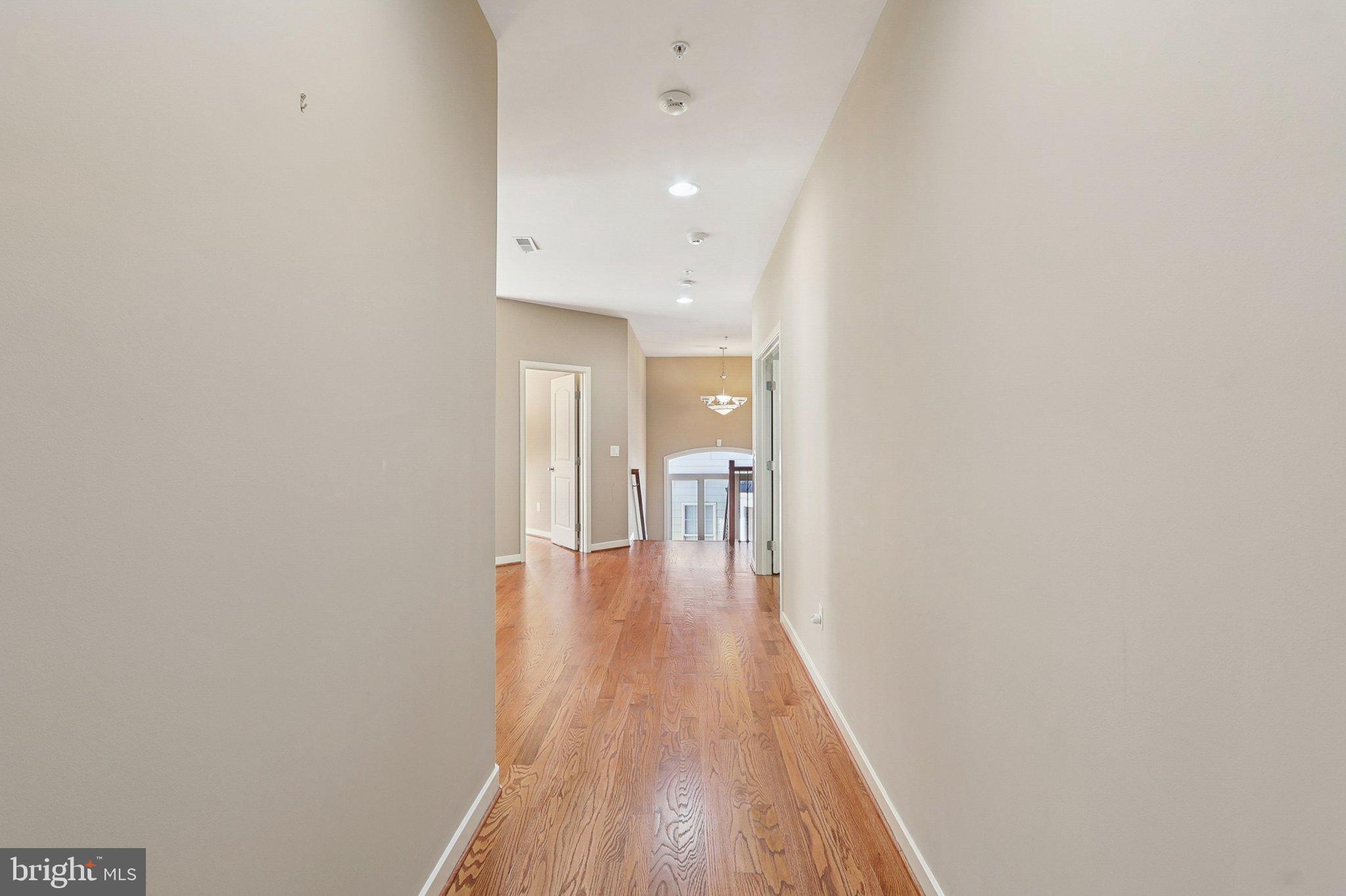 3211 Courtside Road Bowie, MD 20721 - Photo 37 of 108 Upstairs hallway with warm wooden floors.
