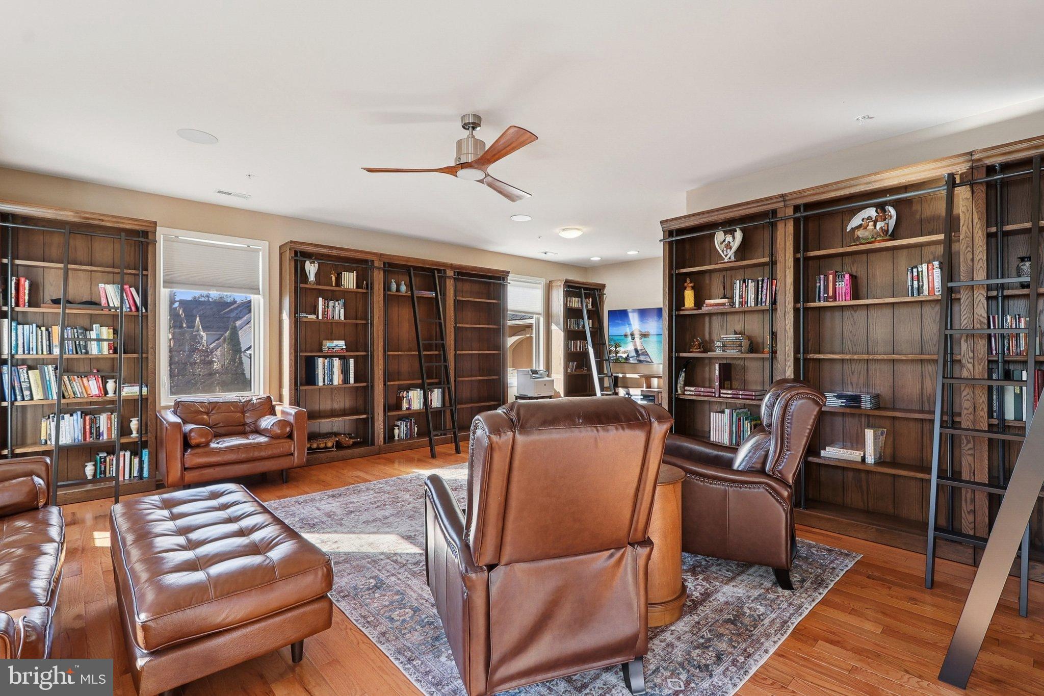 3211 Courtside Road Bowie, MD 20721 - Photo 69 of 108 Elegant library with rich wooden shelves.