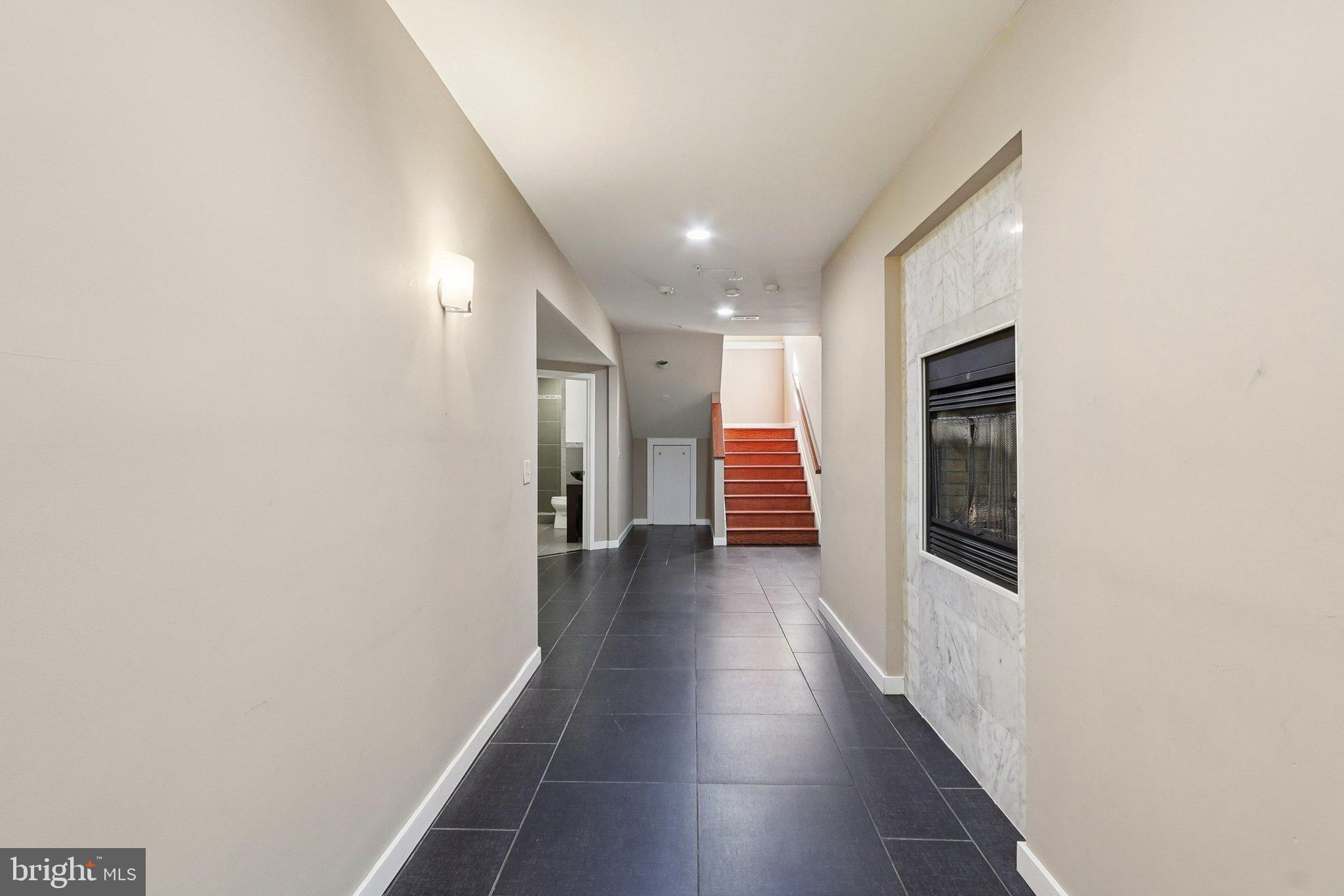 3211 Courtside Road Bowie, MD 20721 - Photo 72 of 108 Spacious hallway with modern elegance.