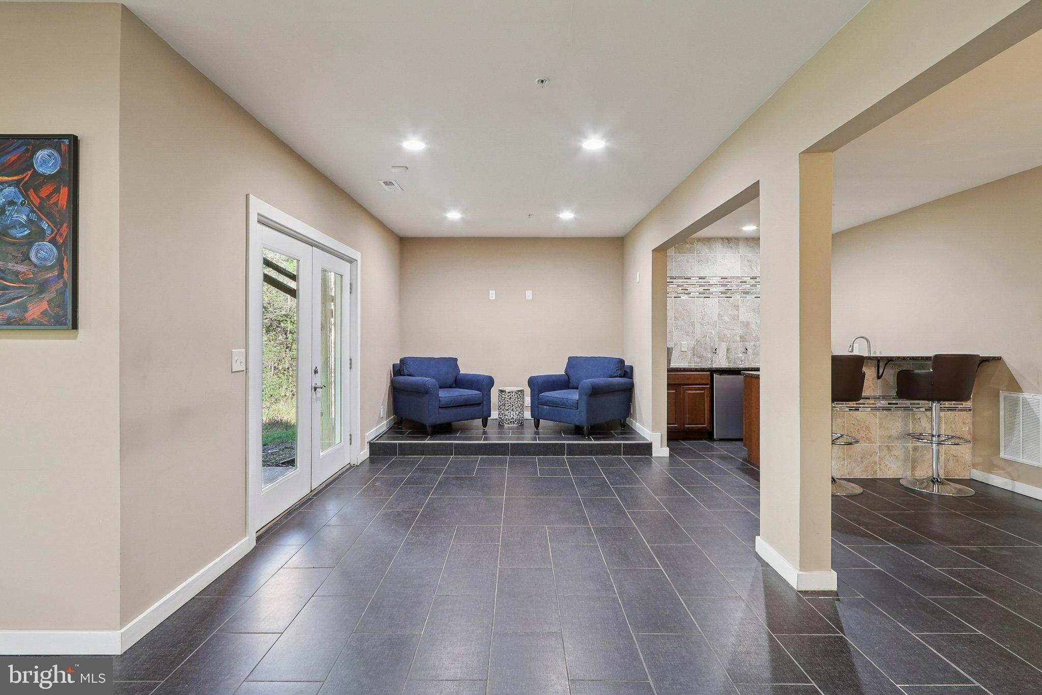 3211 Courtside Road Bowie, MD 20721 - Photo 79 of 108 Spacious modern living area with sleek tiles.