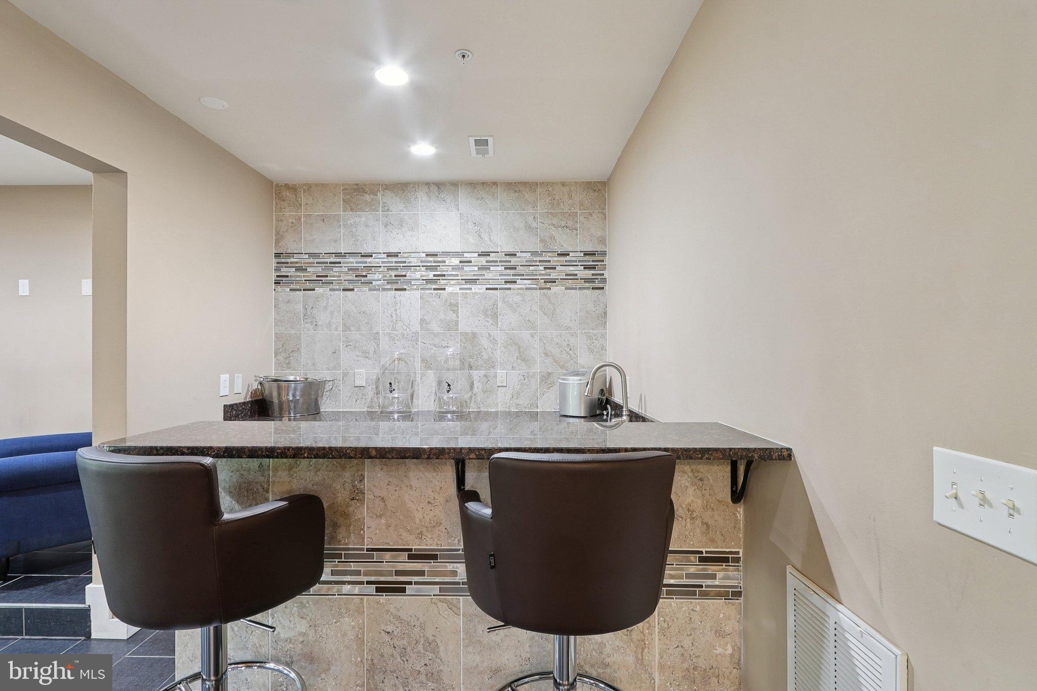 3211 Courtside Road Bowie, MD 20721 - Photo 81 of 108 Sleek bar area with modern finishes.