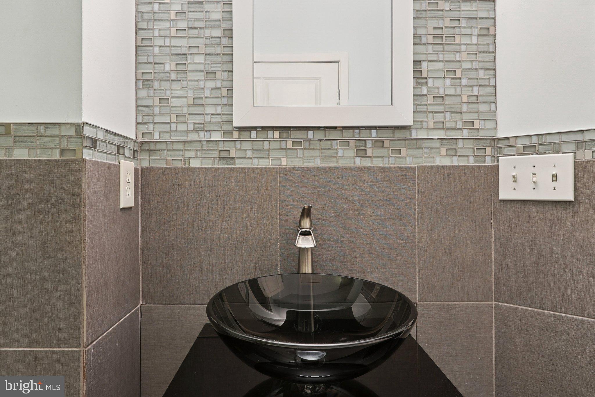 3211 Courtside Road Bowie, MD 20721 - Photo 88 of 108 Sleek modern bathroom with elegant finishes.