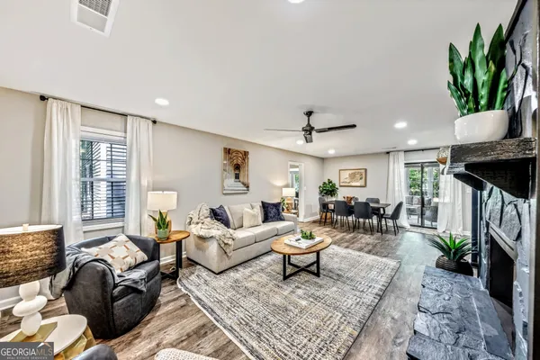 a living room with furniture and a rug