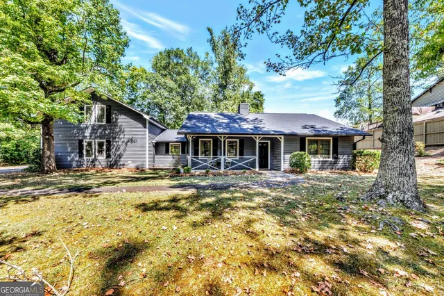 a front view of a house with swimming pool