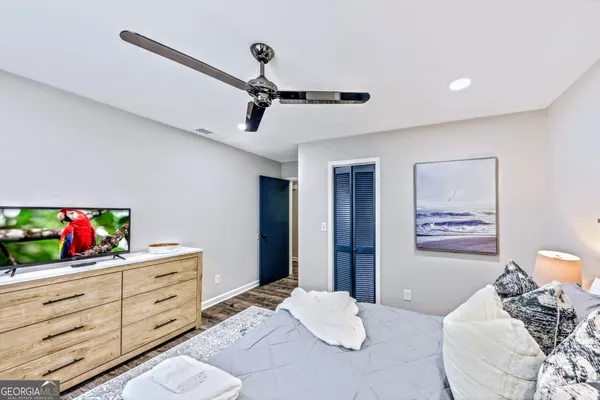 a bedroom with a bed and a dresser