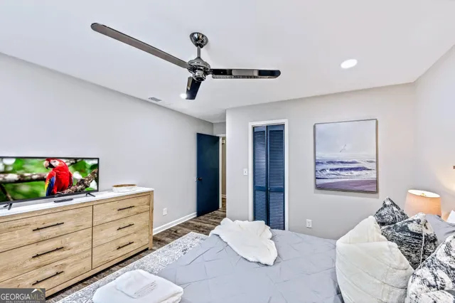 a bedroom with a bed and a dresser