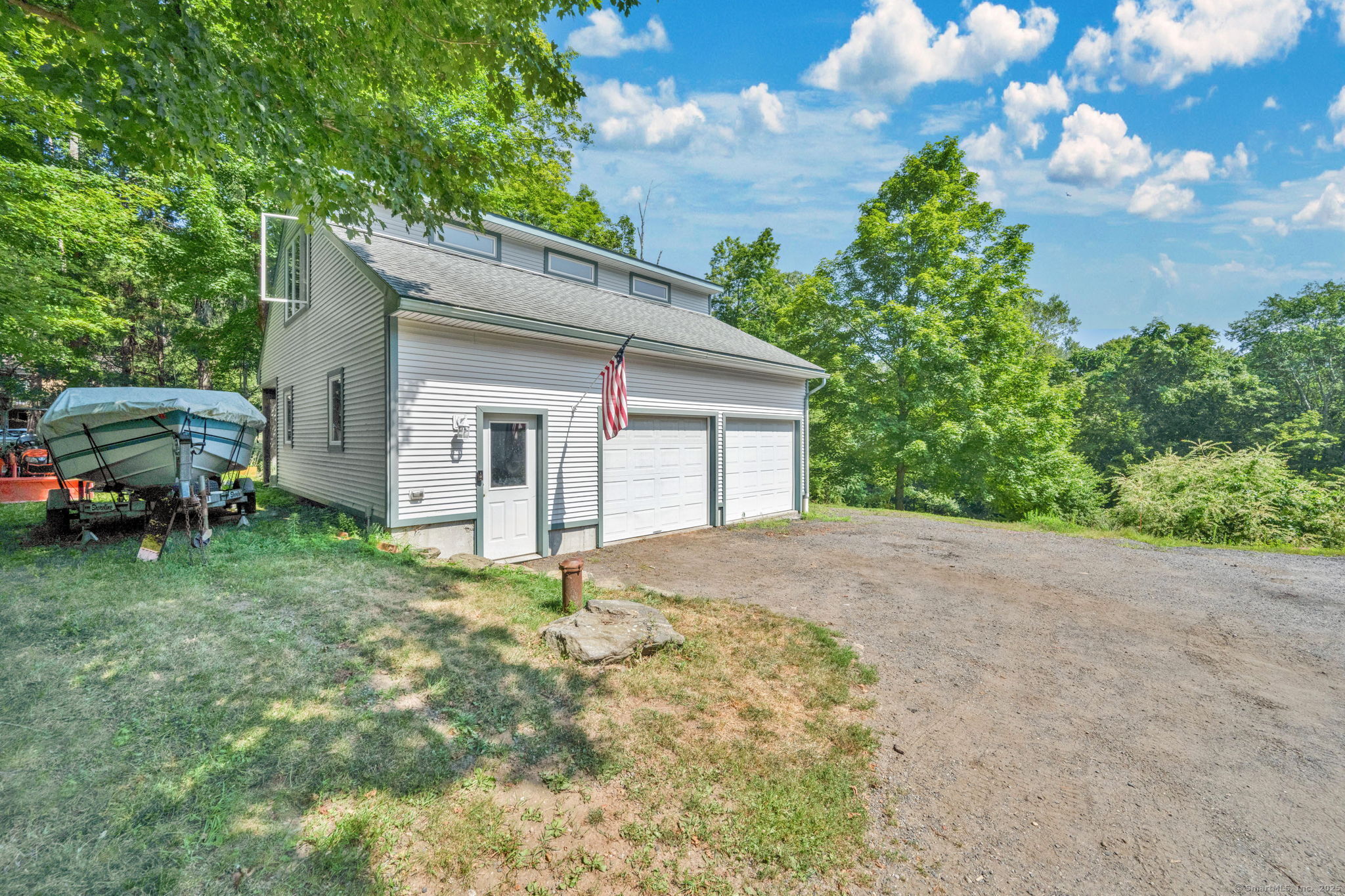 49 South Main Street Marlborough, CT 06447 - Photo 31 of 40 Oversized 2 car garage with workspace, unfinished upper level that can be finished and is ready to add a bathroom.