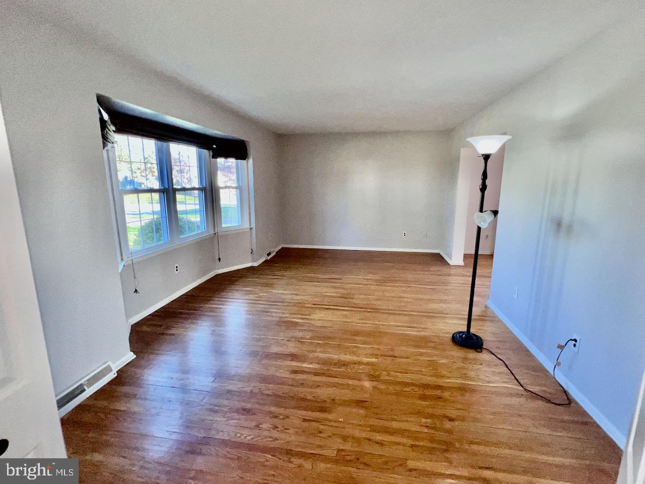 918 Rockwell Road Wilmington, DE 19810 - Photo 12 of 80 wooden floor in an empty room with a window