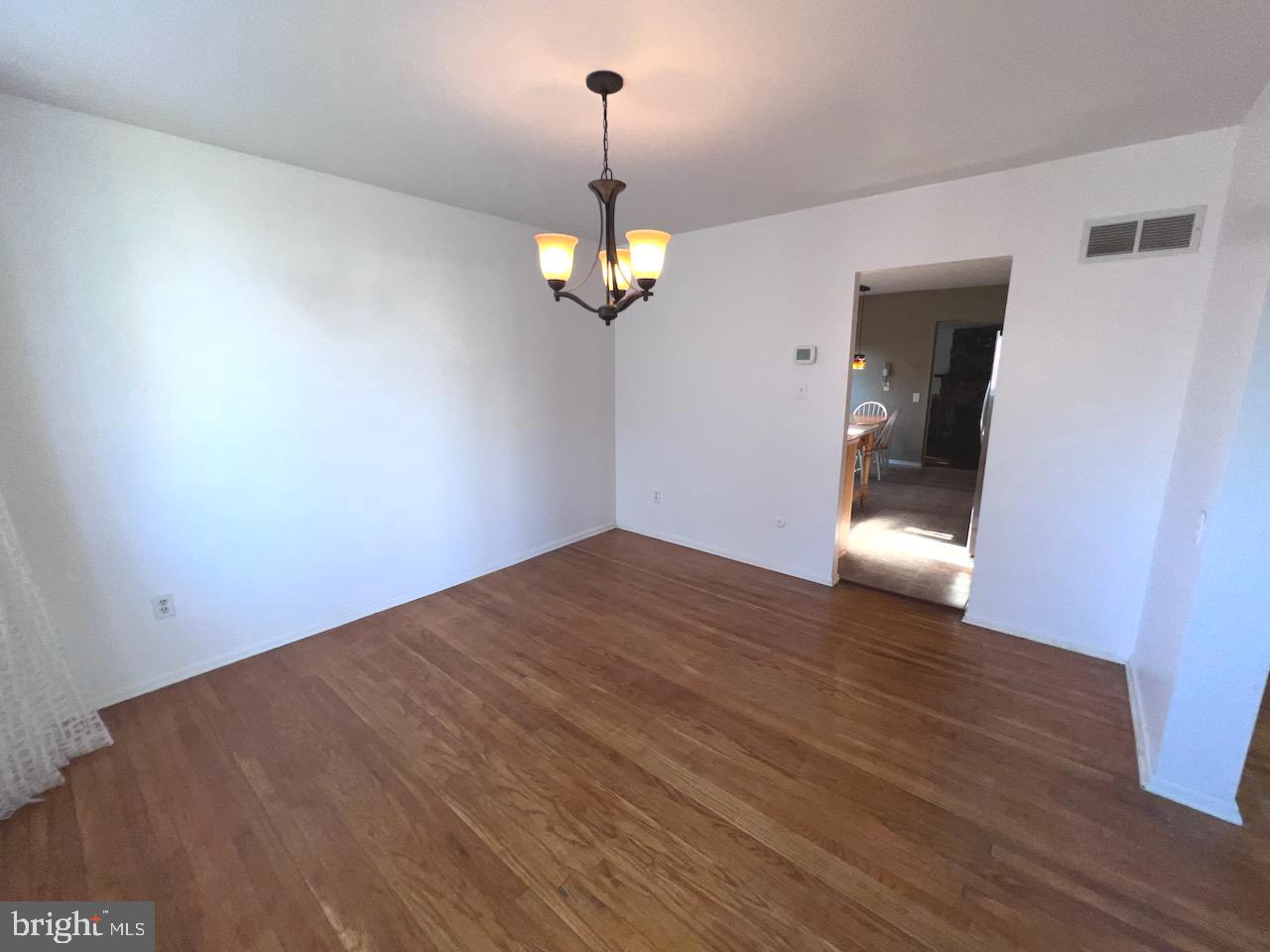 918 Rockwell Road Wilmington, DE 19810 - Photo 20 of 80 a view of a room with wooden floor chandelier and a ceiling fan