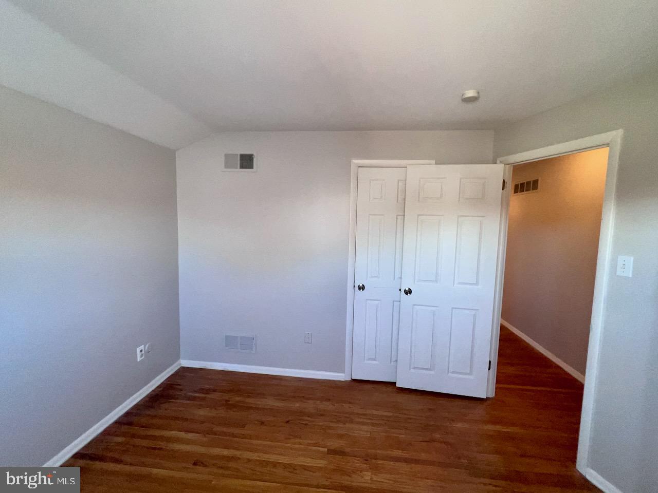 918 Rockwell Road Wilmington, DE 19810 - Photo 44 of 80 a view of an empty room with wooden floor and closet area
