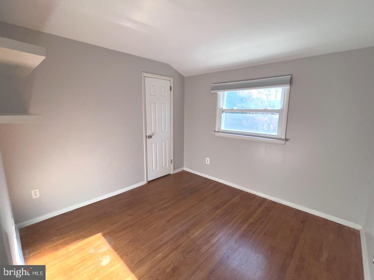 918 Rockwell Road Wilmington, DE 19810 - Photo 45 of 80 a view of empty room with wooden floor and fan