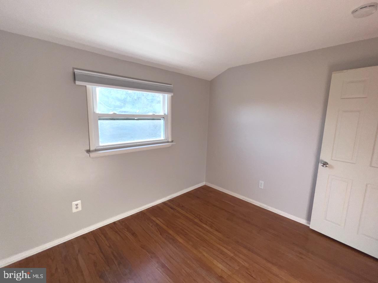 918 Rockwell Road Wilmington, DE 19810 - Photo 46 of 80 an empty room with wooden floor and windows