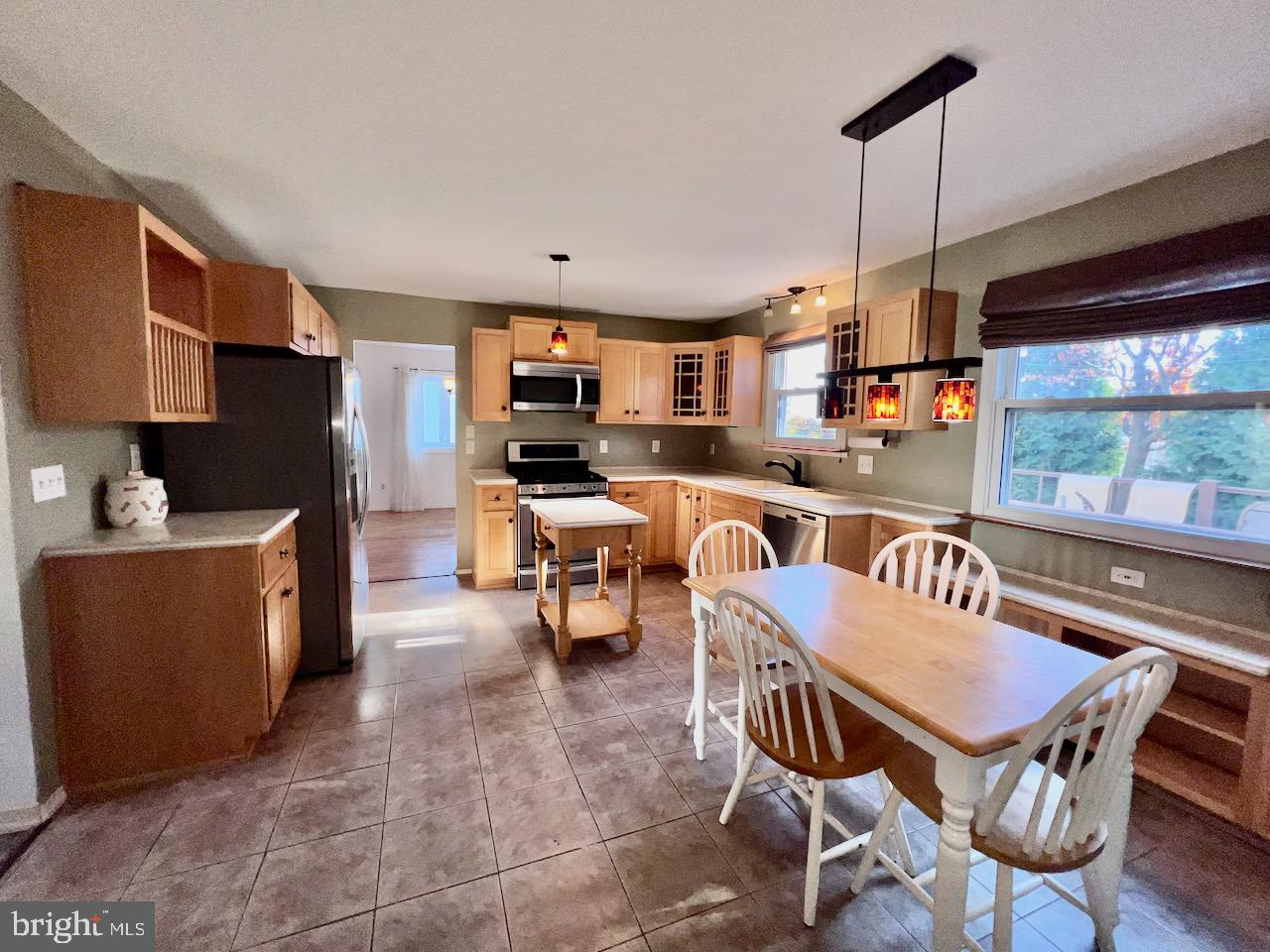 918 Rockwell Road Wilmington, DE 19810 - Photo 6 of 80 a kitchen with a table chairs and a wooden floor