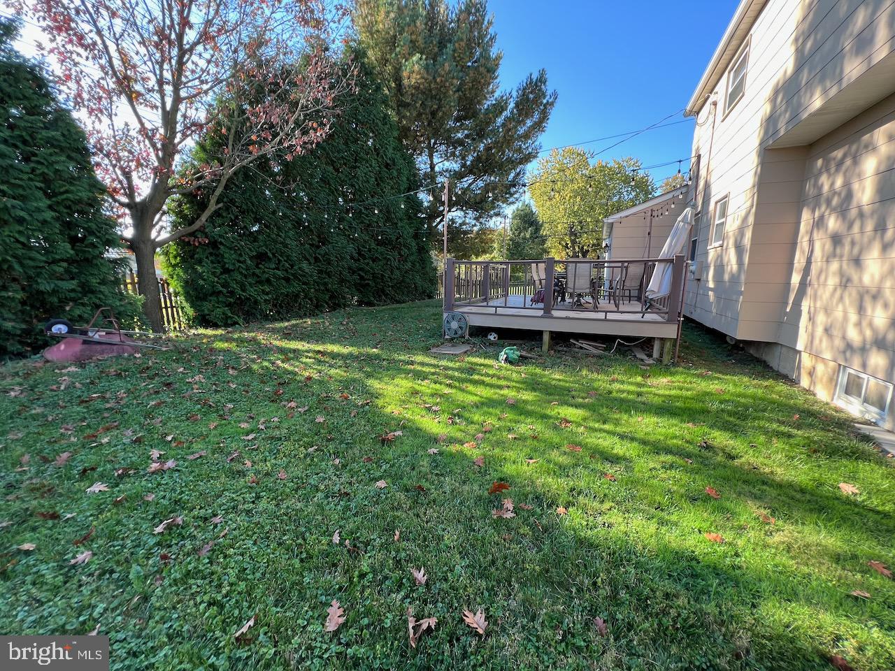 918 Rockwell Road Wilmington, DE 19810 - Photo 70 of 80 a backyard of a house with wooden table and chairs