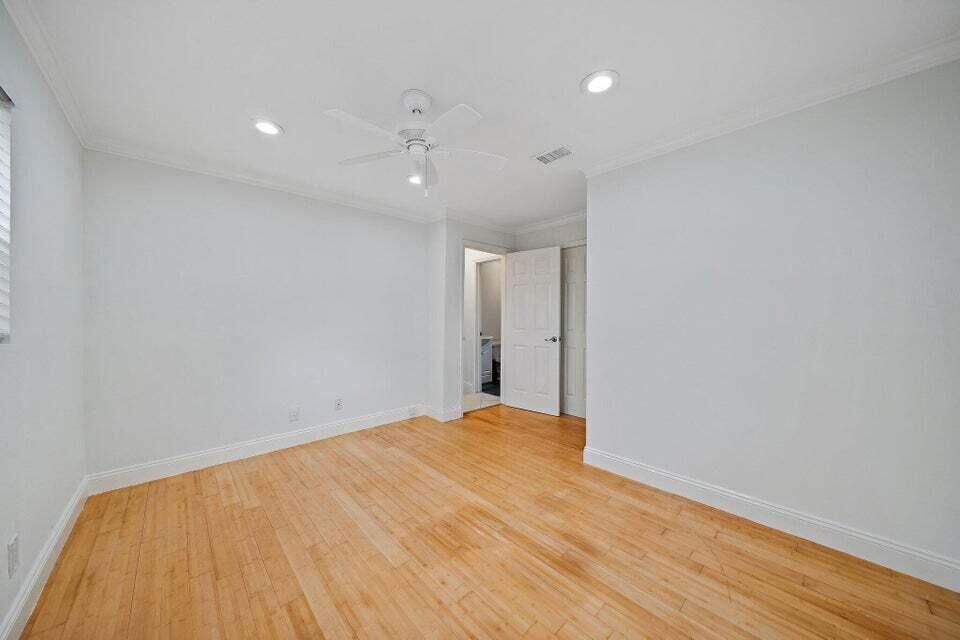 5889 Williamson Road Jupiter, FL 33458 - Photo 19 of 27 a view of empty room with wooden floor