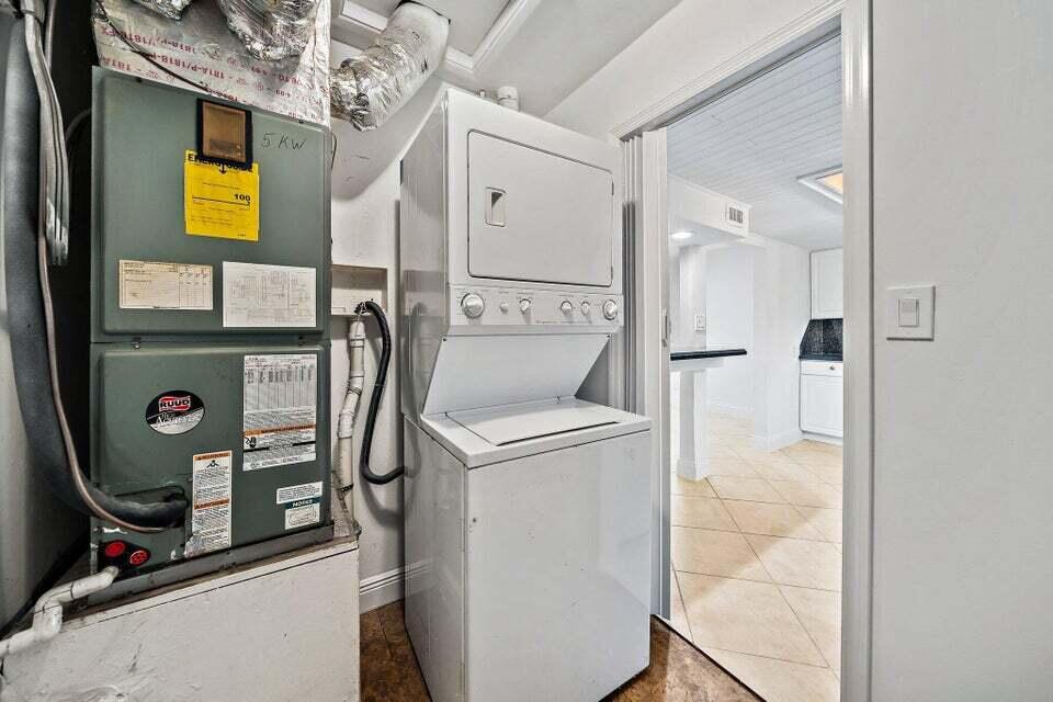 5889 Williamson Road Jupiter, FL 33458 - Photo 27 of 27 a bathroom with a sink a mirror and shower