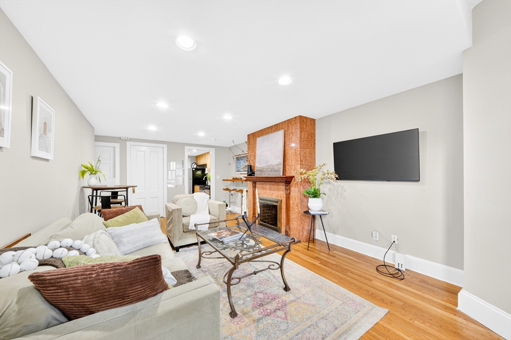 352 Tappan Street, Unit 1 Brookline, MA 02445 - Photo 41 of 42 a living room with furniture and a flat screen tv