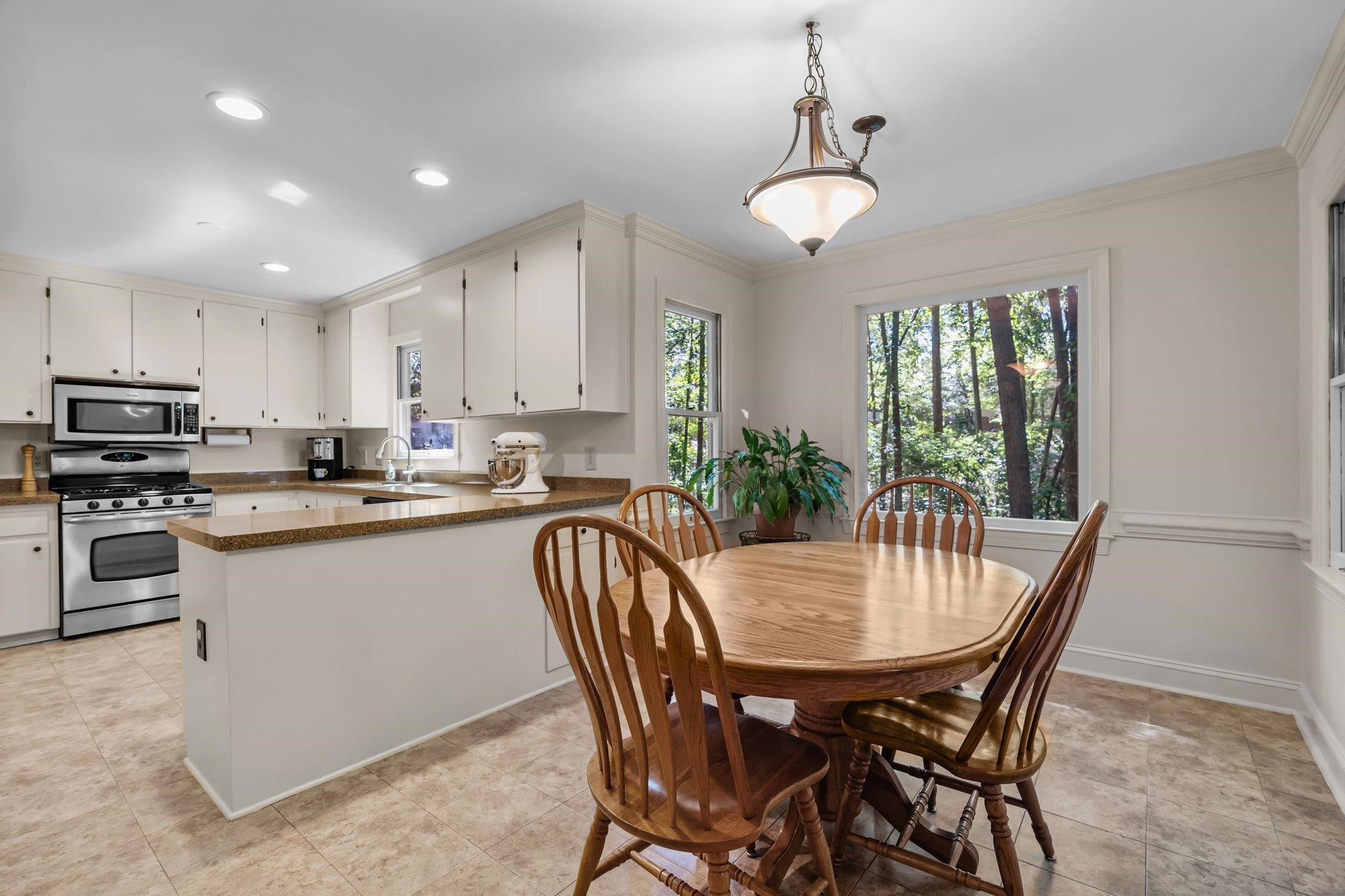 4918 Highgate Drive Durham, NC 27713 - Photo 11 of 44 a view of a dining room with furniture window and wooden floor