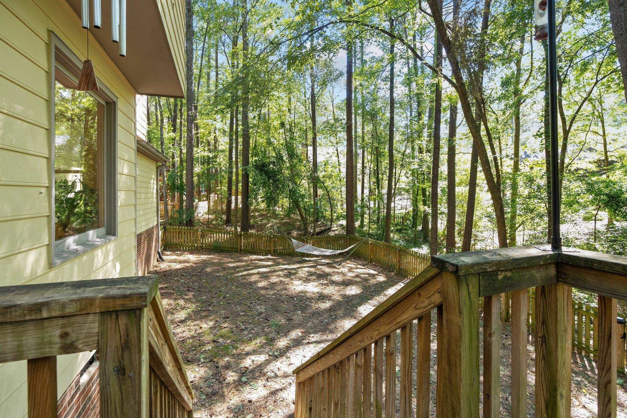4918 Highgate Drive Durham, NC 27713 - Photo 20 of 44 a view of a pathway of a house with a tree