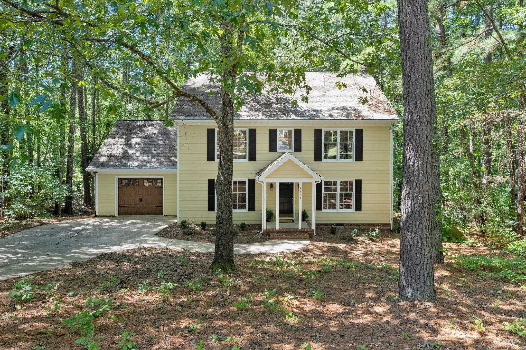 4918 Highgate Drive Durham, NC 27713 - Photo 2 of 44 front view of a house with a yard