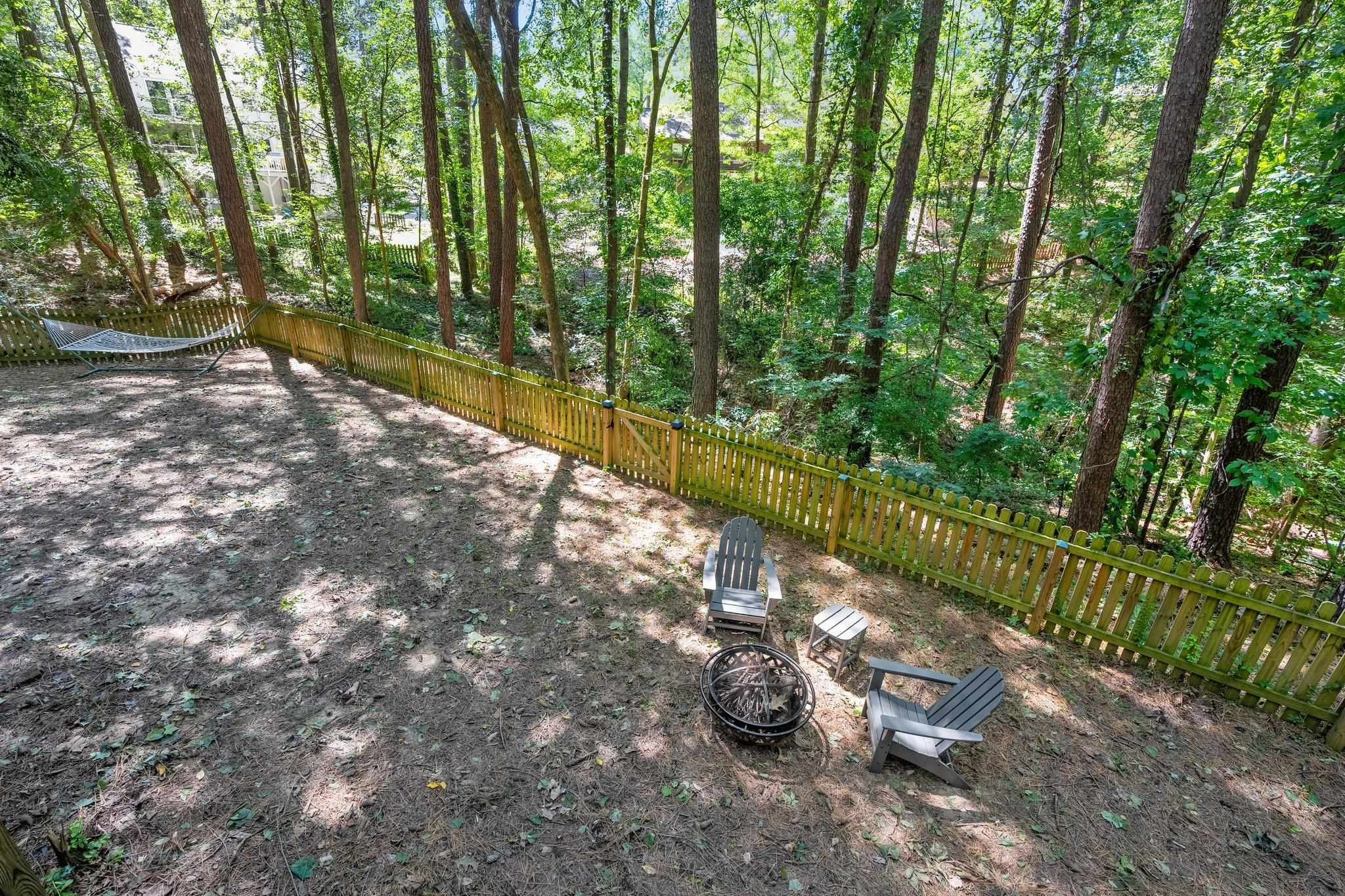 4918 Highgate Drive Durham, NC 27713 - Photo 22 of 44 a view of a back yard with green space
