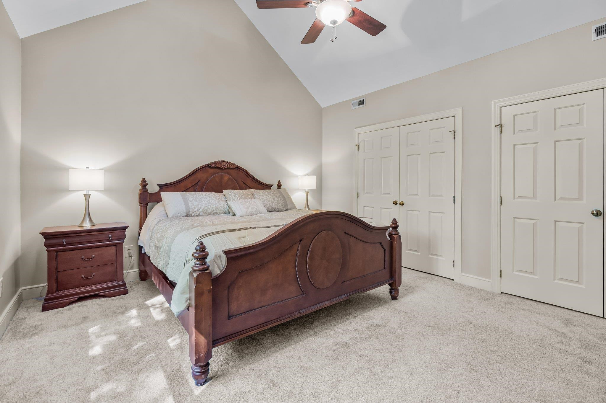 4918 Highgate Drive Durham, NC 27713 - Photo 27 of 44 a bedroom with a bed and a lamp