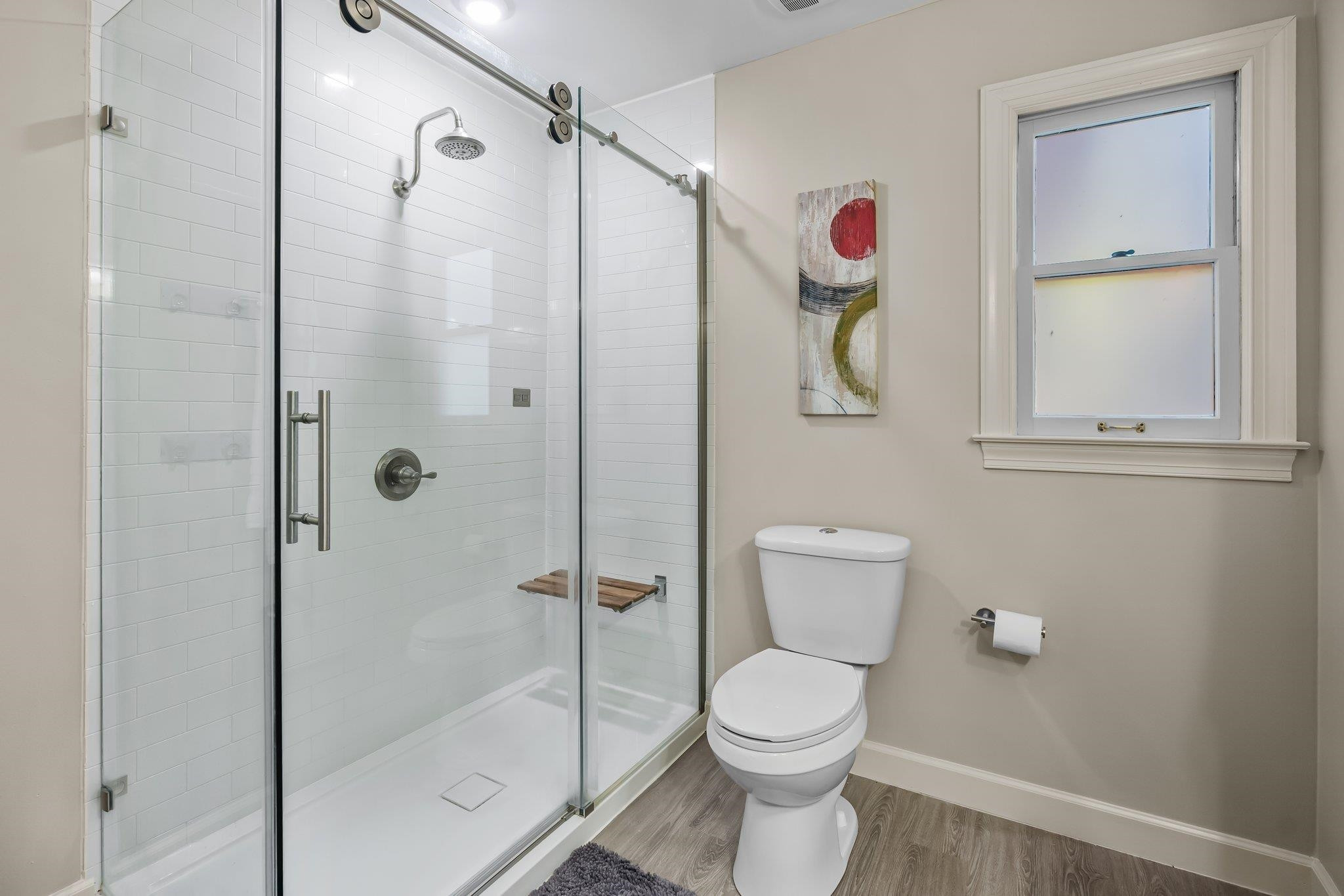 4918 Highgate Drive Durham, NC 27713 - Photo 29 of 44 a bathroom with a toilet sink vanity and shower