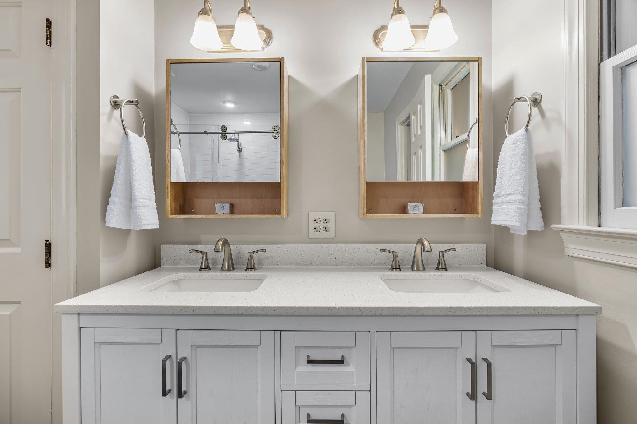 4918 Highgate Drive Durham, NC 27713 - Photo 30 of 44 a bathroom with double sink and a mirror