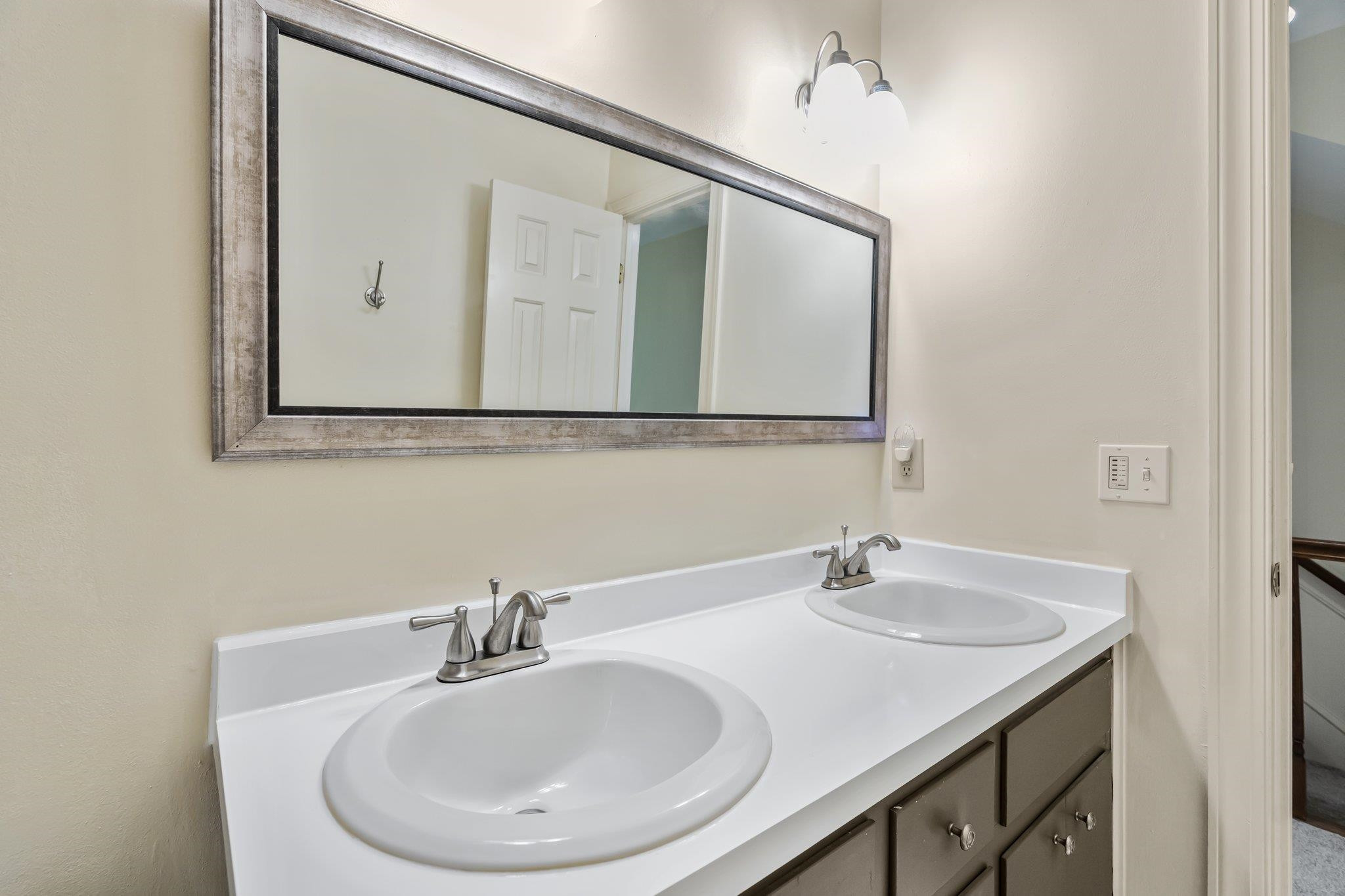 4918 Highgate Drive Durham, NC 27713 - Photo 35 of 44 a bathroom with a sink and a mirror